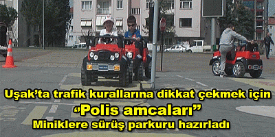 Uşak’ta trafik kurallarına dikkat çekmek için polis amcaları minik öğrencilere sürüş parkuru hazırladı